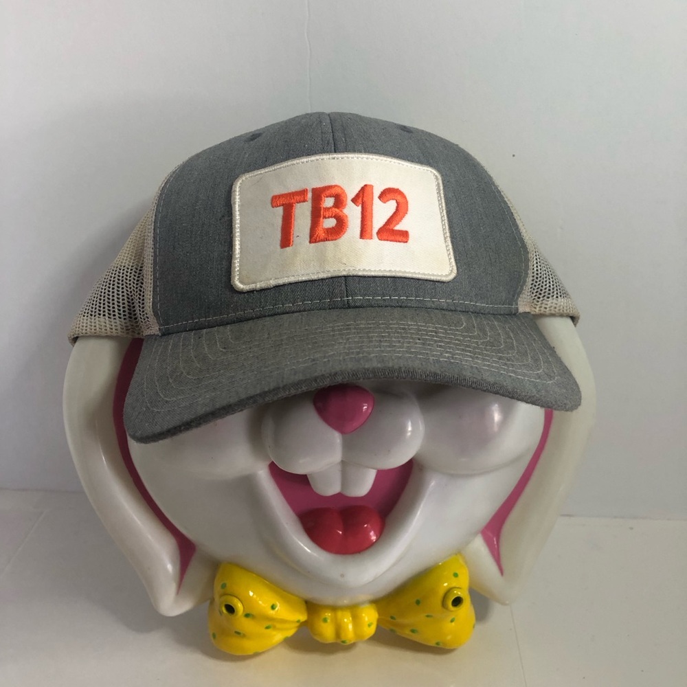 TB12 Hat. Adjustable Size. Grey/Orange. Some Slight Wear And Staining On Mesh.